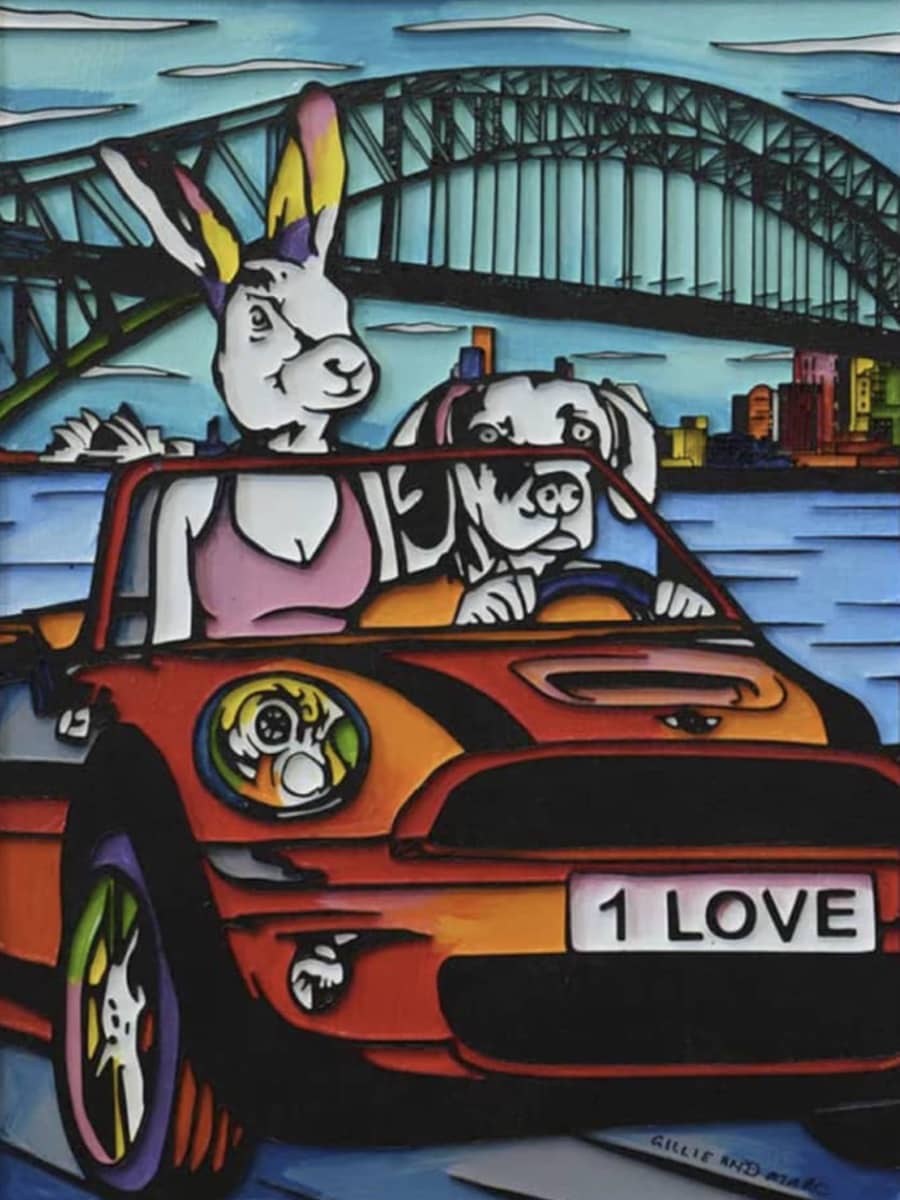 Gillie and Marc original painting ~ 'It Was a Day They Would Never Forget' @ Curate Art & Design in Daylesford, Gillie and Marc's premier gallery in Victoria, Australia.

A stylised cartoon artwork showing a rabbit and a dog driving a red convertible car in front of a bridge and city skyline. The rabbit has long ears with yellow, purple, and pink tips, and the car has a license plate reading '1 LOVE'.