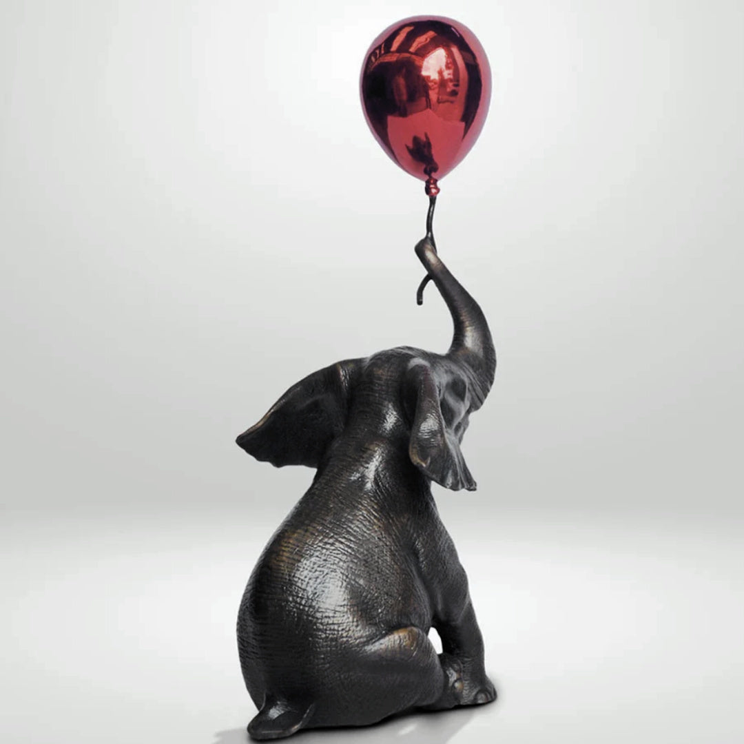 Gillie and Marc Sculpture ~ 'Elephant Makes a Wish with Red Balloon' @ Curate Art & Design in Daylesford, Gillie and Marc's premier gallery in Victoria.
Decorative elephant figurine with a red balloon.