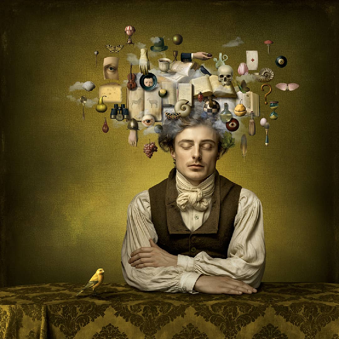 Maggie Taylor Art ~ 'A Thousand Words' 22" (Framed) - Available in Australia @ Curate Art & Design in Daylesford. Free delivery to Melbourne. 

A surreal portrait of a young man with closed eyes, seated at a table, with a small yellow bird beside him and a cluster of floating objects and ideas forming a cloud above his head. The background is a textured olive-green wall, and the table has a dark patterned damask cloth.