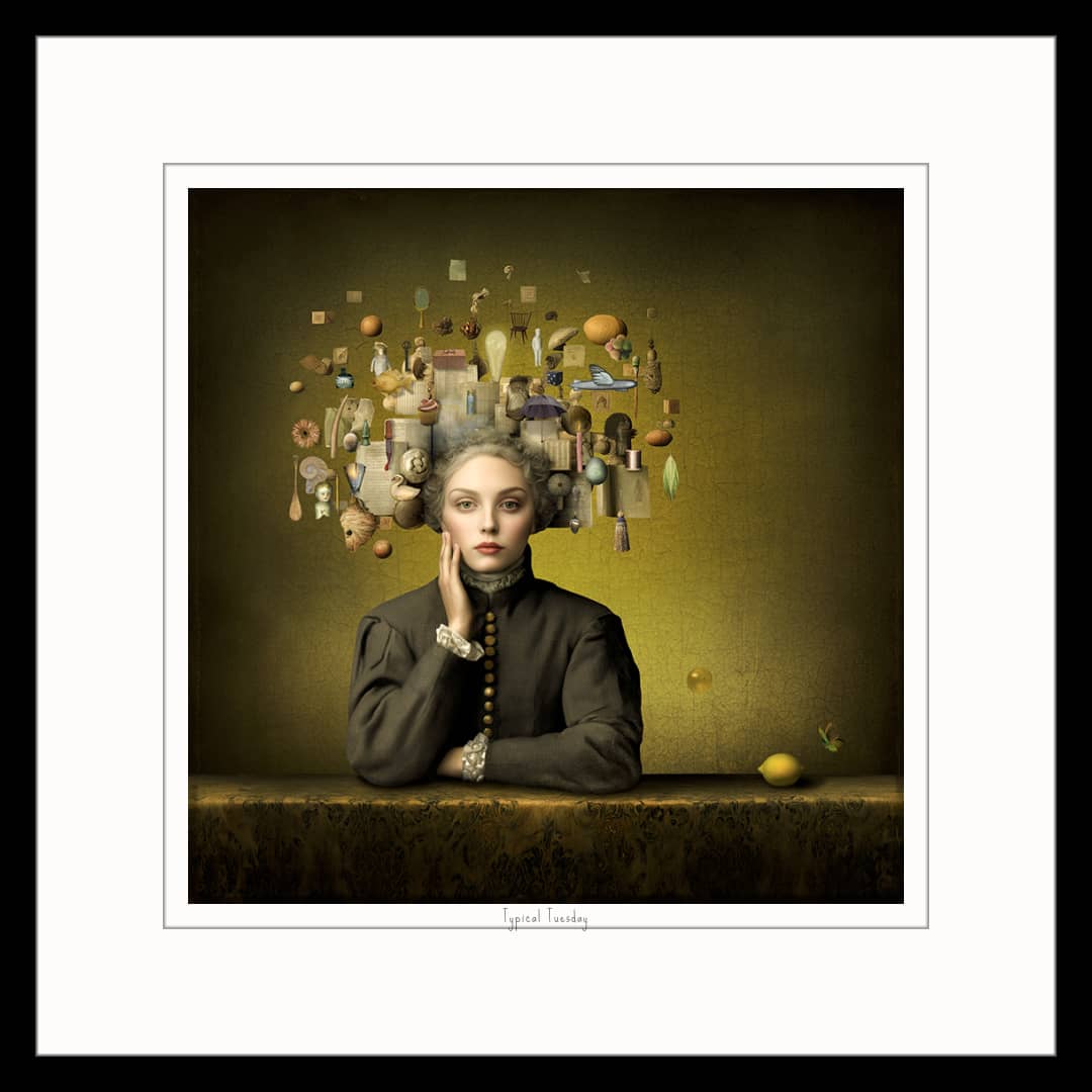 Maggie Taylor Art ~ 'Typical Tuesday' 22" (Framed) - Available in Australia @ Curate Art & Design in Daylesford. Free delivery to Melbourne.

A framed art print featuring a classical-style portrait of a woman with a surreal floating collection of objects and bottles above her head, set against a dark olive background. The print is matted with a white border and enclosed in a black frame.