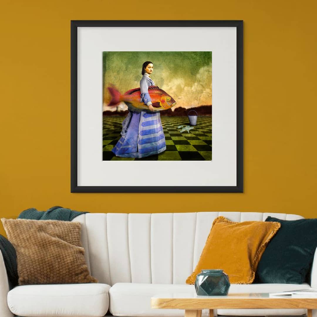 Maggie Taylor Art ~ 'Woman Who Loves Fish' 22" (Framed) - Available exclusively in Australia @ Curate Art & Design Gallery in Daylesford. Free delivery Melbourne.
Woman holding a large fish in a surreal landscape with a checkered floor.