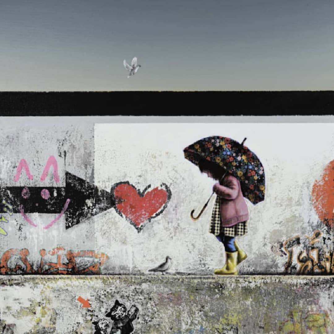 UK artist Steve Johnston painting ~ 'Hi Bird' @ Curate Art & Design (Daylesford, Melbourne) - Steve Johnston's exclusive representatives in Australia.

A artwork depicting a child in a pink coat and yellow rain boots walking under a floral umbrella on a graffiti-covered wall, with a seagull in the sky above.
